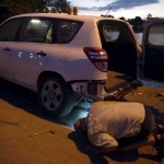 Fixing a flat tire after day of fishing